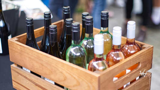 Crate of Assorted Wine Bottles at Event