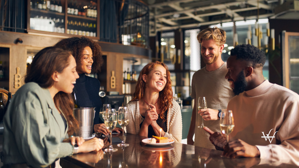 Diverse Group of Friends Celebrating Birthday at a Wine Bar
