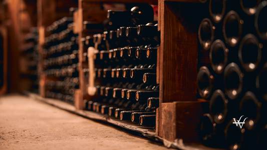 Wine bottles with corks stored in wine cellar