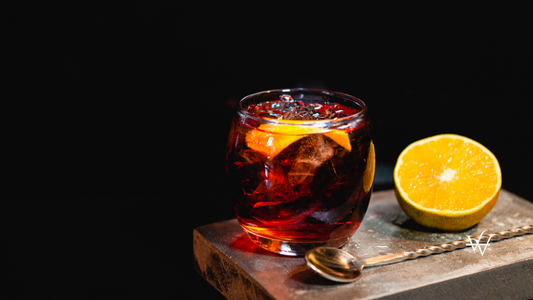 Boulevardier cocktail on stone background in gray color