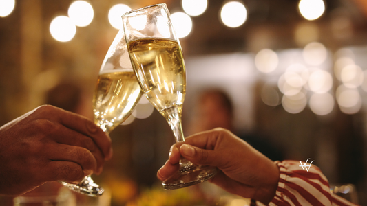 Couple Toasting Champagne Glasses at Party