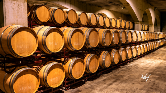 Stacked_wine_barrels._Wooden_barrels_containing_macerating_wine.