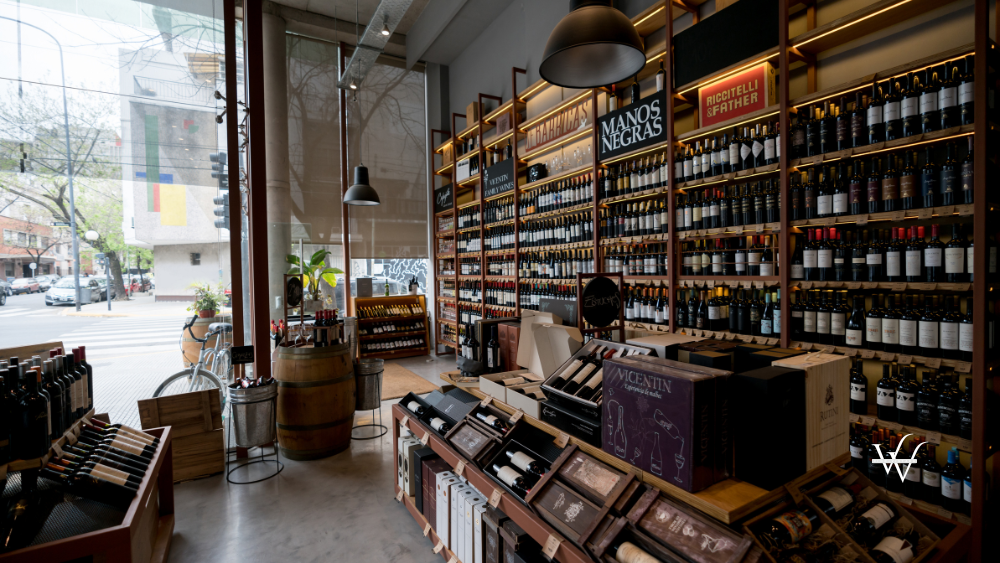 View of a wine shop with shelves and stands full of wine bottles