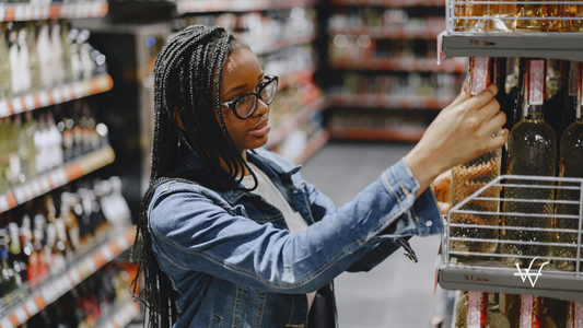 Woman_Shopping_for_Wine_in_Grocery_Store