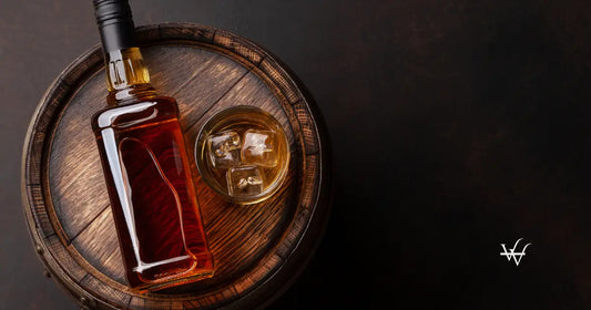 scotch-whiskey-bottle-glass-and-old-barrel